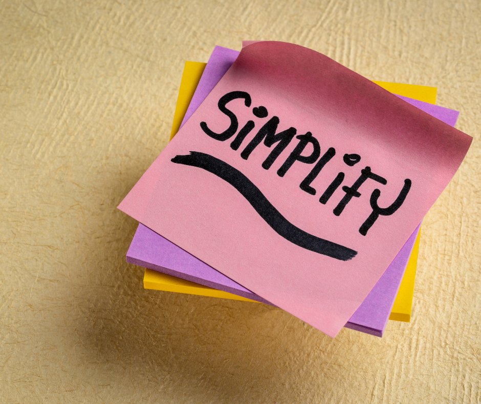 Stack of post-it notes that say "simplify".