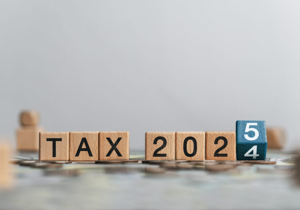 Business tax 2025 concept with wooden blocks and letters. Business budget planning and investment growth in new year concept. Income tax filing and tax filing to pay tax documents online.